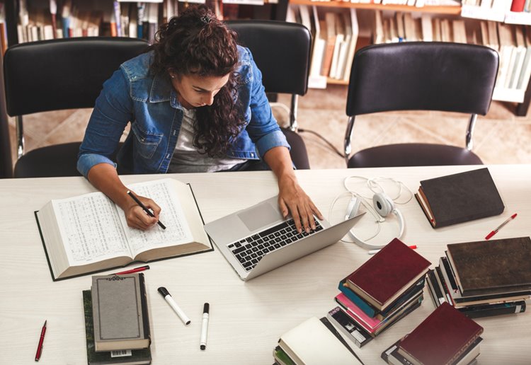 young student studying at library