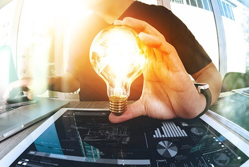 man holding a light bulb