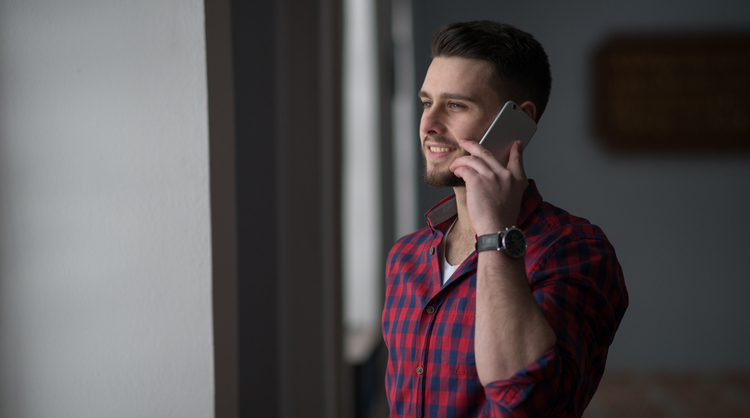 young man speaking on the phone