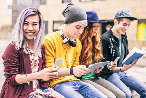 group of teenagers hanging out on rooftop