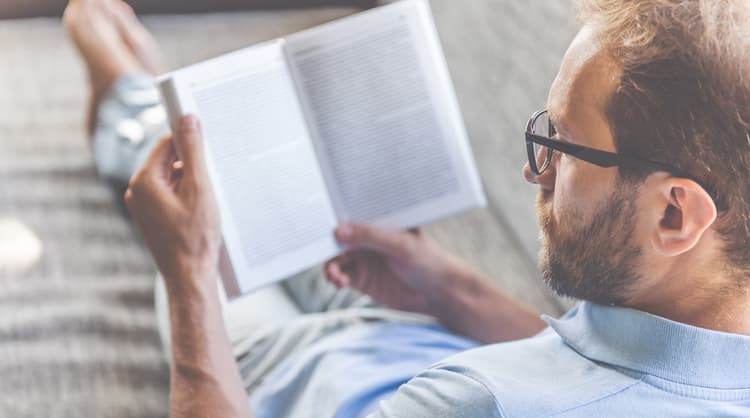 bearded man reading book