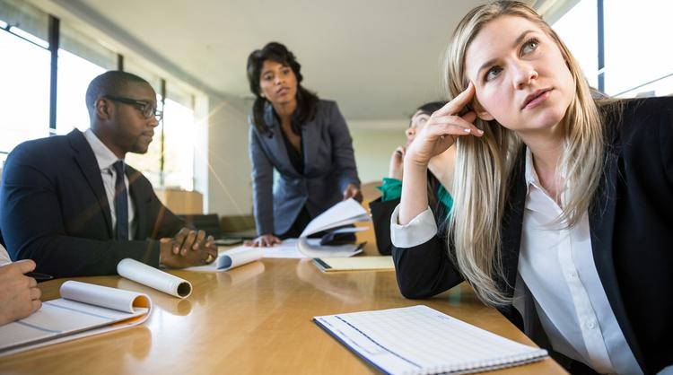 employee looking bored at meeting