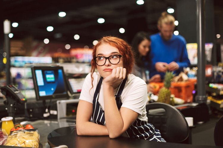 young woman employee daydreaming