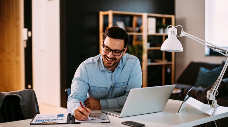 man working from home happily