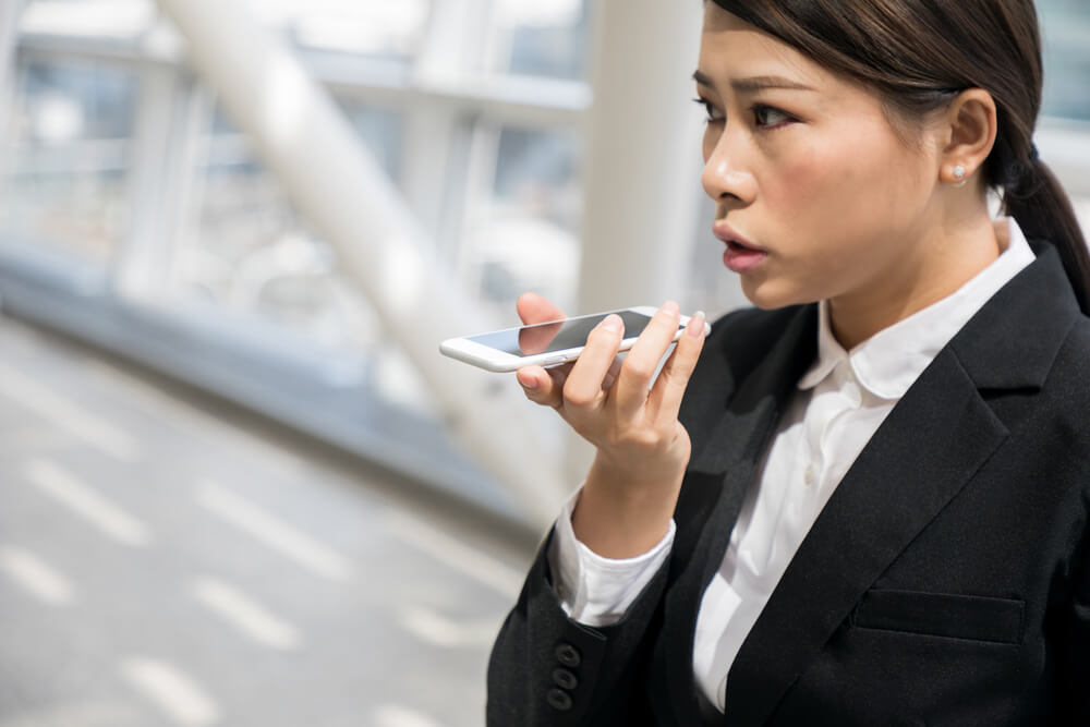 asian woman talking on smartphone