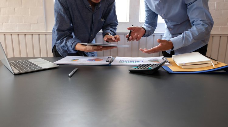 two men reviewing analytics