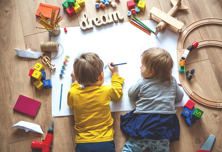 toddlers working on drawing