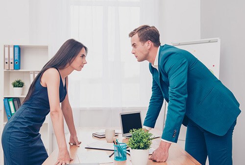 colleagues staring angrily at each other