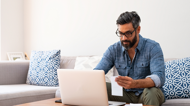 mature man working on laptop