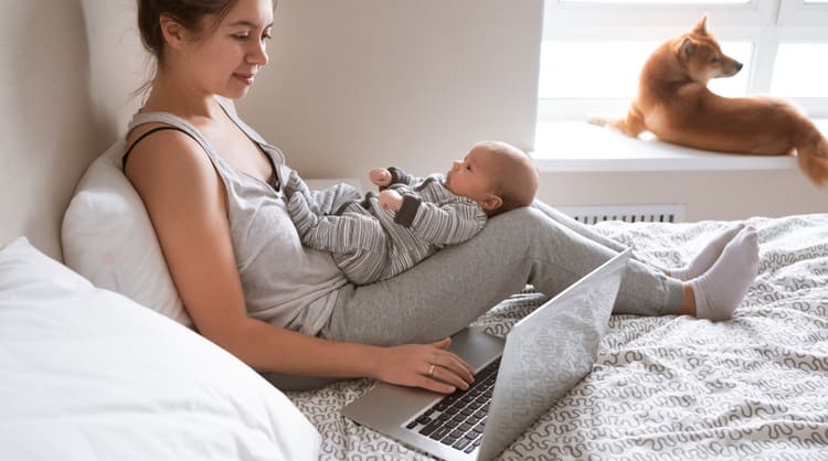 mother with newborn working from home