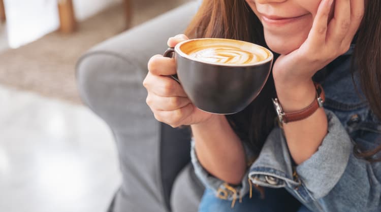 woman drinking coffee at home