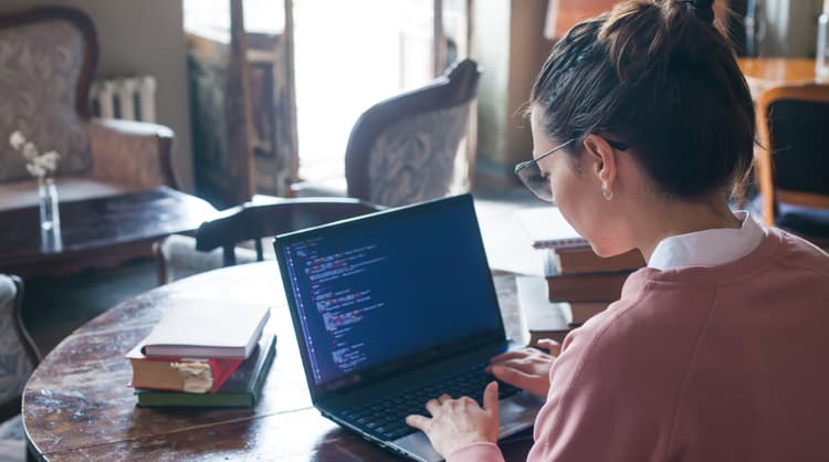 woman learning how to code at home