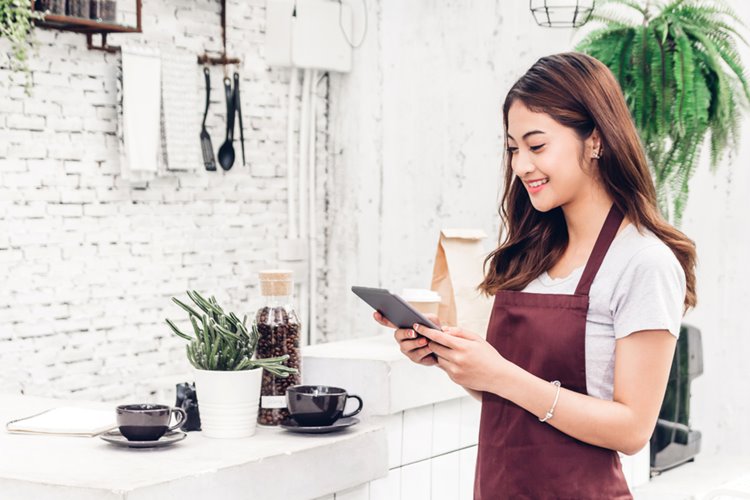 young asian woman cafe business owner